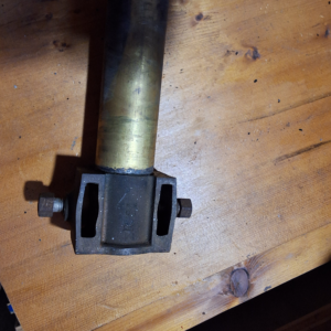 Row boat motor tilt lock bracket